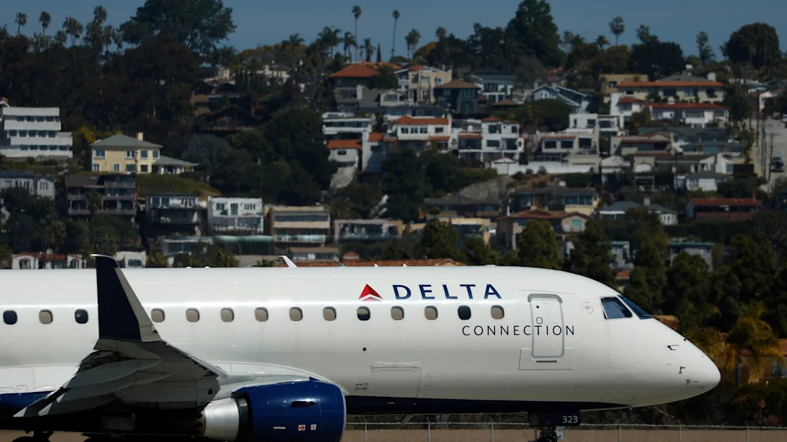 Delta stock falls after company cuts outlook, citing ‘macro uncertainty’