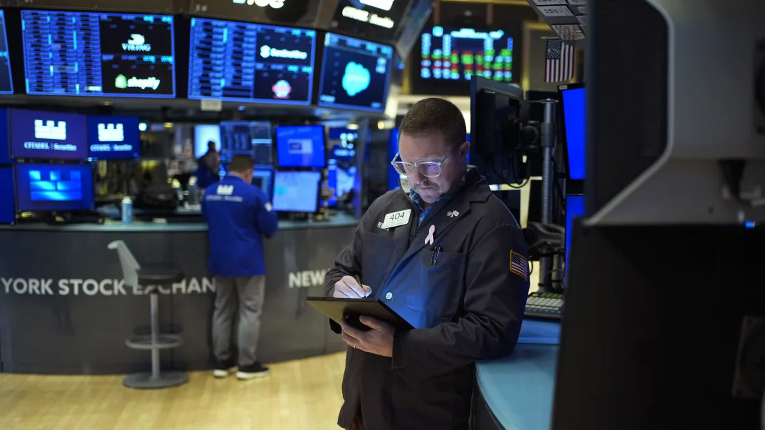 Wall Street falls following Trump’s tariffs but pares its losses after Mexico announces a delay