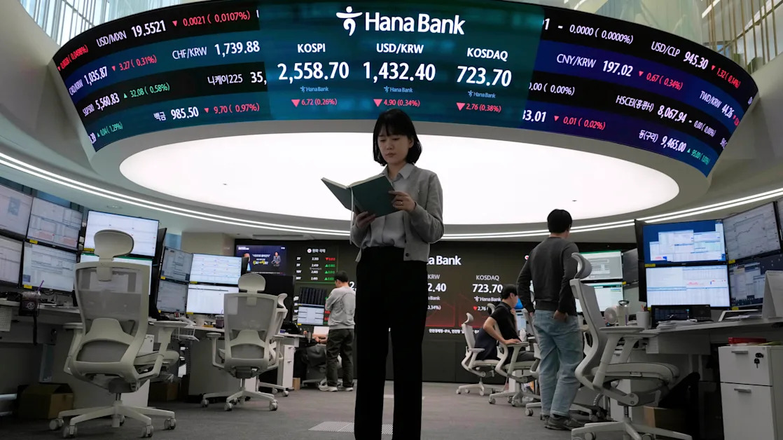 Asian shares are mixed, tracking gains on Wall Street as corporate profits pile higher